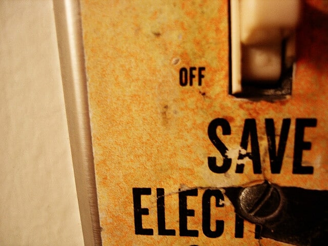 go green -- photo of switchplate that says "save electricity"