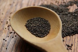 Foods That Help You Sleep -- photo of wooden spoon with chia seeds