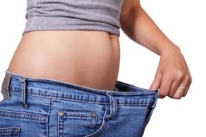 health benefits of collagen -- photo of someone wearing too- large jeans 