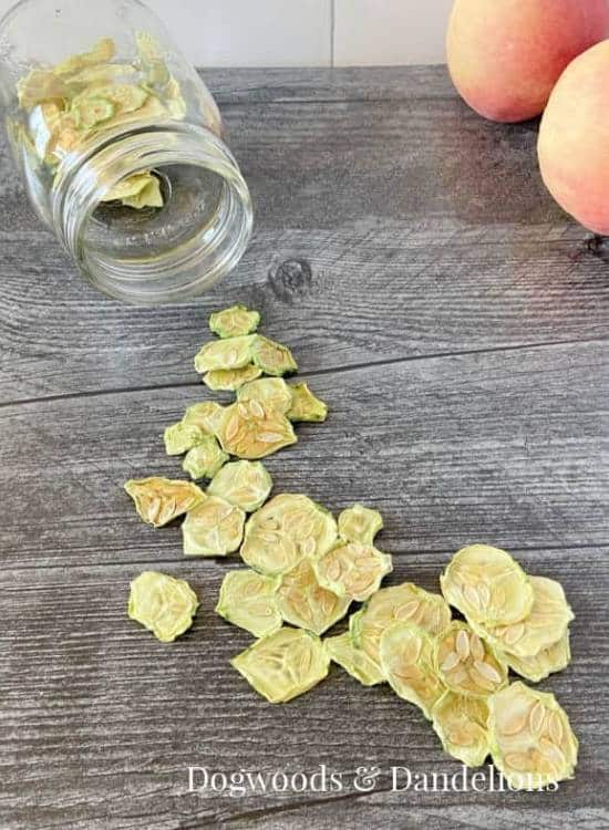 photo of dehydrated cucumber slices on wooden table