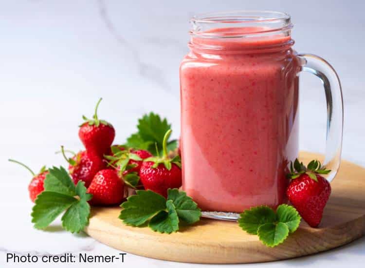 photo of strawberry smoothie, which can be made with whole strawberries or added strawberry tops