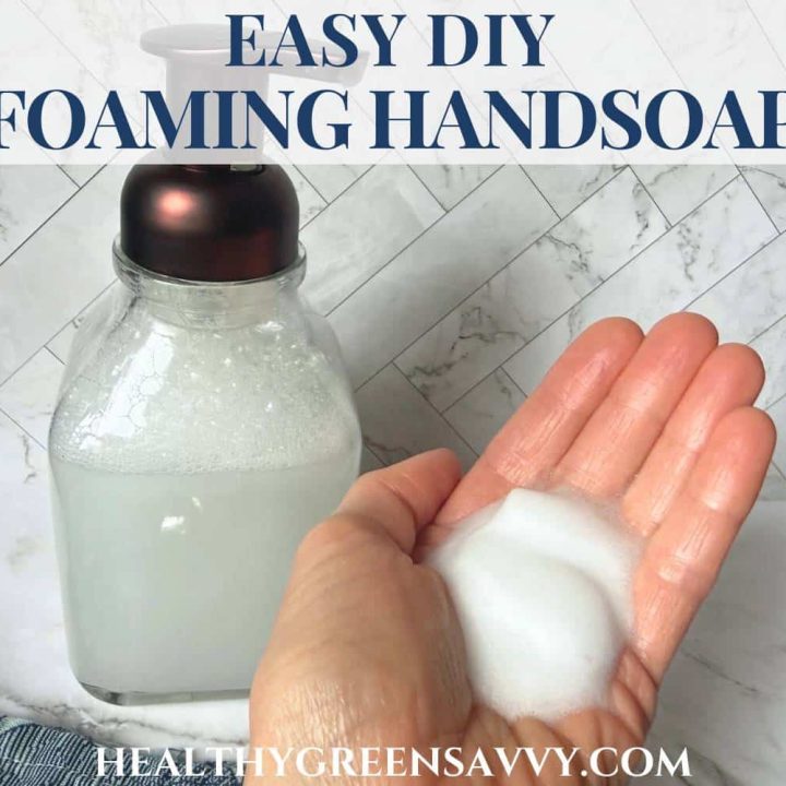 cover photo of DIY foaming hand soap in bottle and on hand with title text overlay
