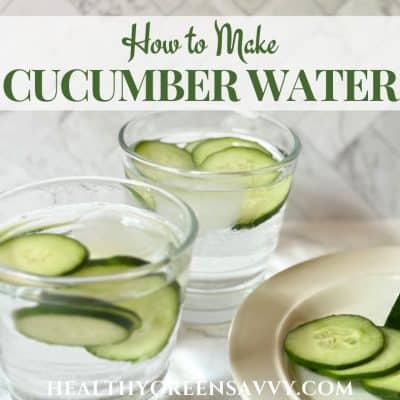 cover photo of cucumber water recipe served in glasses with slices of cucumber on marble background with title text overlay